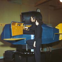 A WAVES Link Trainer instructor gives pointers to an officer