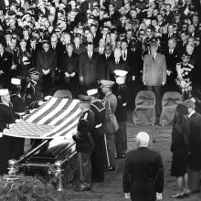 Burial and folding of the flag ceremony for President John F. Kennedy. 