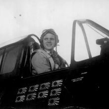 Man in cockpit of aircraft