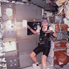 John Glenn on STS-95 wearing experiment sensors and other equipment. 