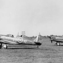 Two spitfires taking off