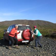 CEPS scientists next to their field vehicle.