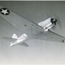 Aircraft in flight with two stars on wingtips