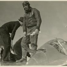 man climbing out of Lightning cockpit