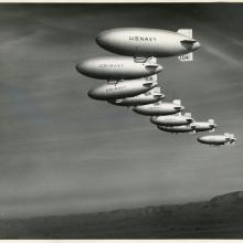 nine airships flying