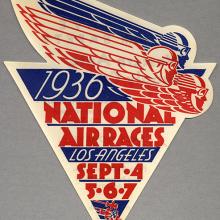 Small sticker in red and blue. Shaped like a triangle and includes the text 1936 National Air Races Los Angles Sept. 4, 5, 6, and 7. 