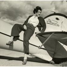 woman standing by aircraft