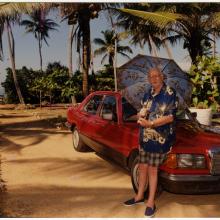 Arthur Clarke near the beach in Sri Lanka, leaning on his car, early 2000s. 