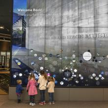 Children try out an interactive display in the Boeing Milestones of Flight Hall 