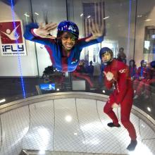 A student attending the "She Can" STEM camp goes indoor skydiving on a field trip to iFly in Ashburn, Virginia. 