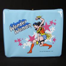 blue lunchbox with Wonder Woman on it, against a black background