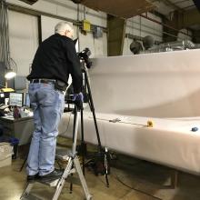 Volunteer Jim Walker takes a high-resolution photograph of a Langley artifact.