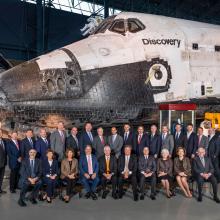 Group photo in front of Space Shuttle Discovery. 