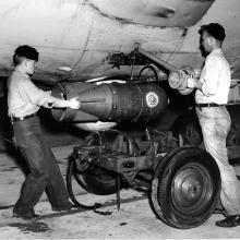 Two crewmen load K-ship