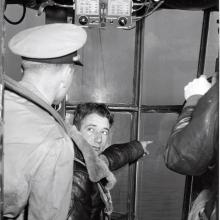 Three airmen inside K-ship cabin