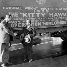 Two men in front of aircraft