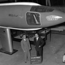 Two men in front of aircraft