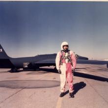 Man in red and white overals in front of U-2