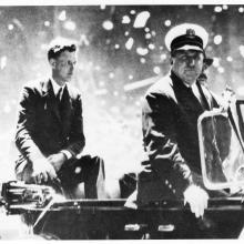 Informal portrait of Charles Lindbergh in a parade. 