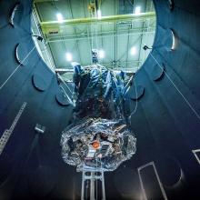 The Parker Solar Probe being lifted out of a vacuum testing chamber 