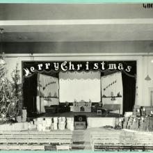 Auditorium decorated for the holidays, Christmas tree on left