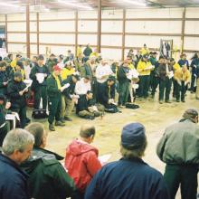 Fire crews gather for a morning briefing in a warehouse in Palestine, Texas on February 23, 2003 before venturing out to search for Columbia debris. 