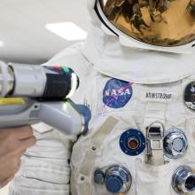 laser arm with spacesuit