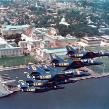 Blue Angles flying in formation over the training aircraft carrier