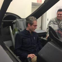 AirSpace host Nick Patridge sitting in F-16 ejection trainer