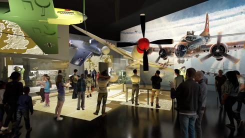 Severna airplanes hang suspended from the ceiling as visitors look on. 