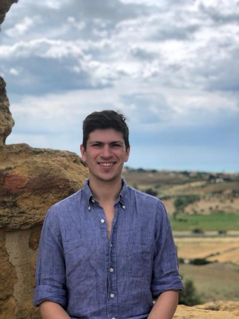 Dr. Haber, a young scientist, standing in a cloudy desert.