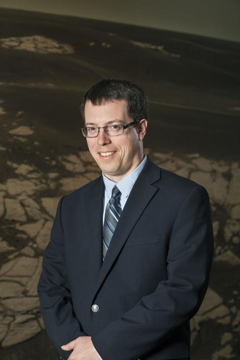 Dr. Ross Irwin, a white male geologist, poses for a portrait.