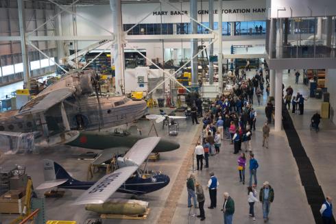 Bird's eye view of visitors inside the Museum's restoration hangar during an open house event.