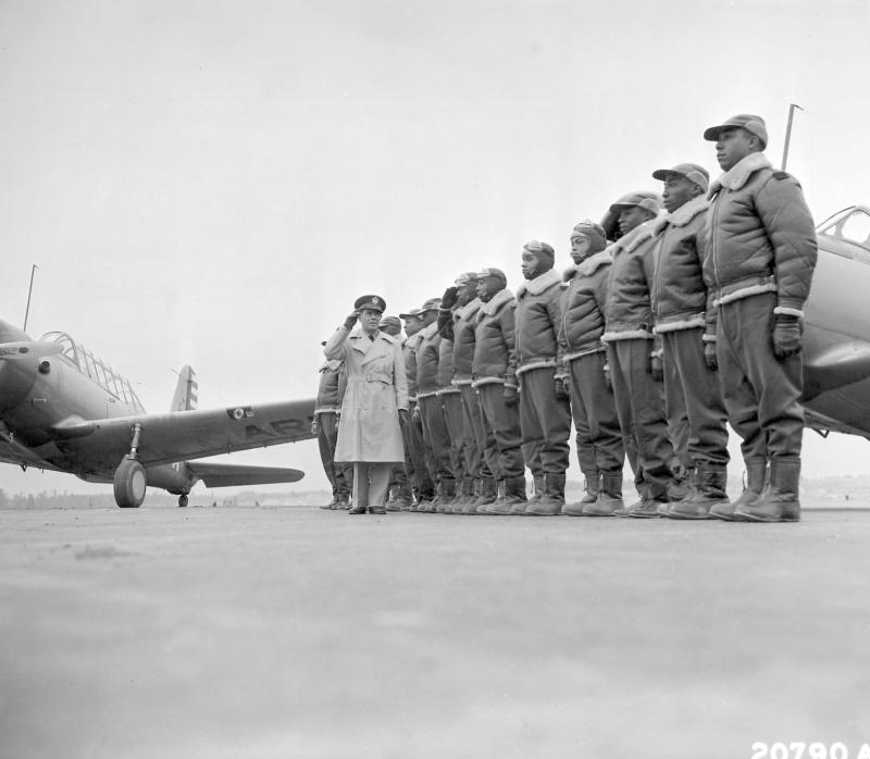 Major James A. Ellison returns the salute of Mac Ross of Dayton