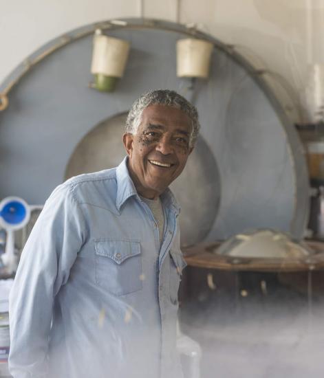 A man smiles at the camera.