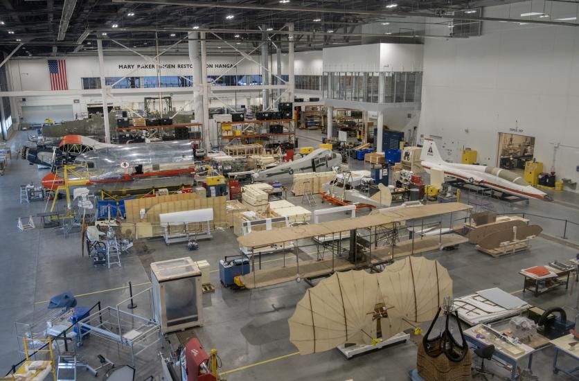 A lab where the Wright Military Flyer is being worked on. You can see the wings in the foreground.