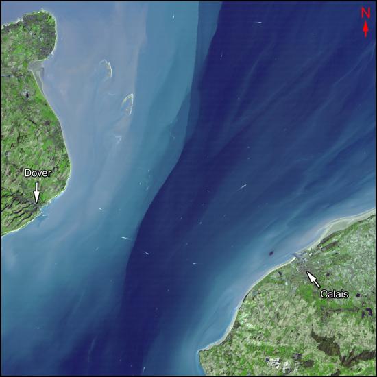 Satellite image of a channel of water with the city of Dover to the west, and the city of Calais to the east.