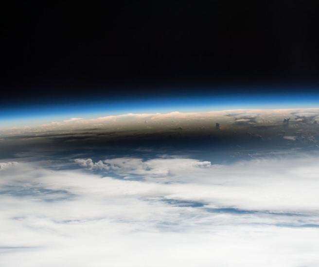 View of the horizon cutting between space and earth.