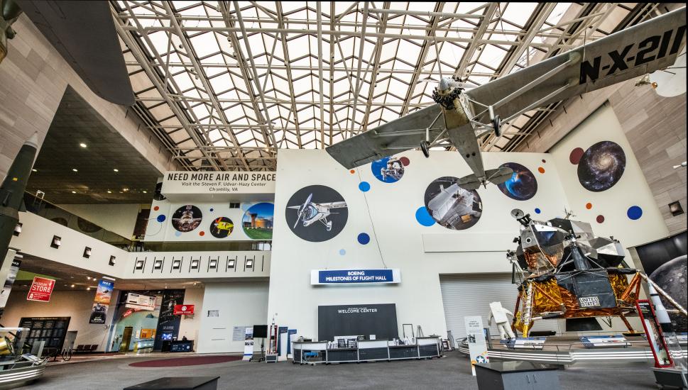 A lunar module and plane are visible in the gallery. 