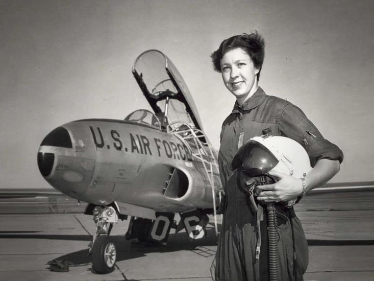 Wally Funk standing with a U.S. Air Force jet.