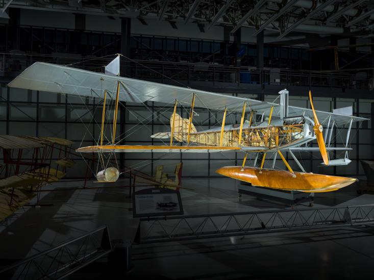 View of the front of a seaplane in a gallery. 