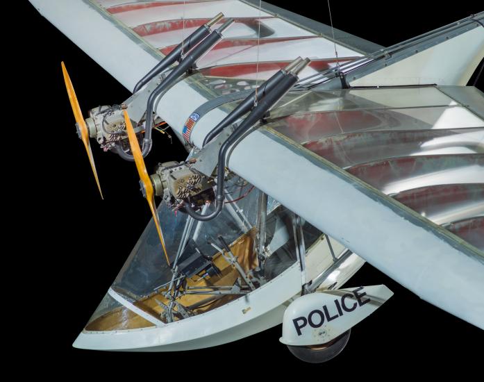 View of cockpit of a twin engine ultralight aircraft. The background of the image is black.