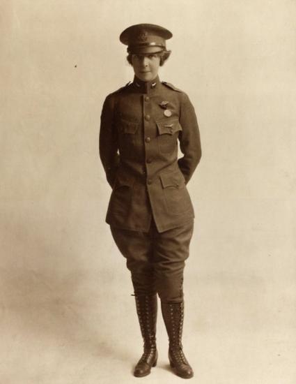 A woman wears an Army aviation uniform. 