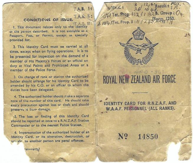 A worn document in sepia tone that displays reads "ROYAL NEW ZEALAND AIR FORCE: IDENTITY CARD FOR R.N.Z.A.F. AND W.A.A.F. PERSONNEL (ALL RANKS)