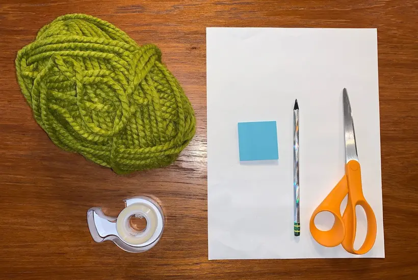 string, post it notes, paper, scissors, tape and string.