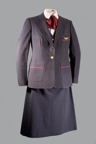 A photo of a dark colored formal uniform on a mannequin. 