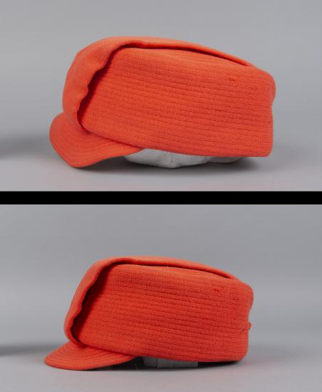 Orange flight attendant hat compared side by side with different viewing angles. Both photographed against a white-grey backdrop.