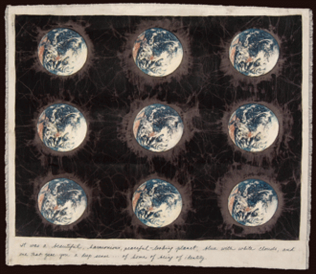 A batik showing nine Earths (full circles) against a dark background.