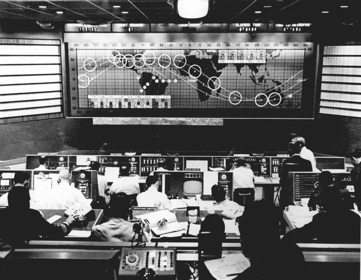 Black and white image of Mercury Mission Control Center during the first orbit of John Glenn's Friendship 7 mission