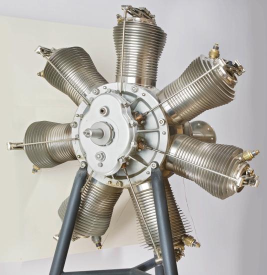 An circular shaped engine with 7 cylinders.